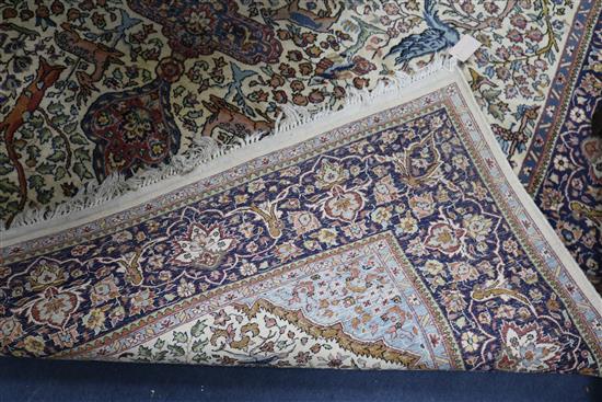 A Persian Tree of life ivory ground carpet W.275 x 180cm